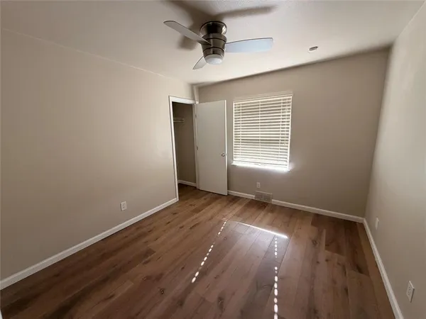a view of gallery with wooden floor