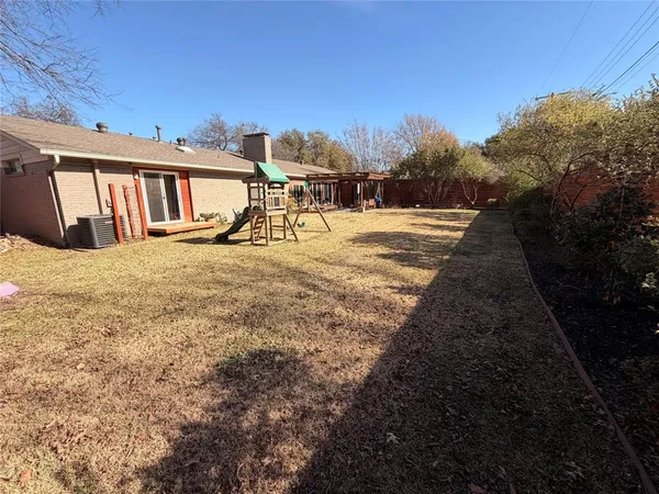 a view of residential houses with outdoor space and seating