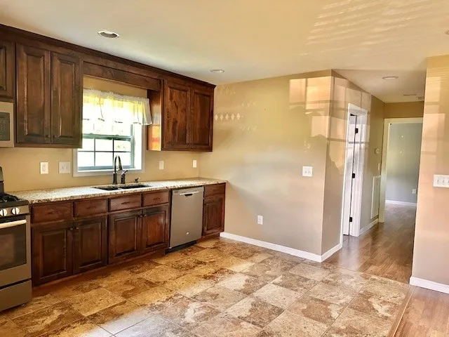 a spacious bathroom with a sink mirror and a shower