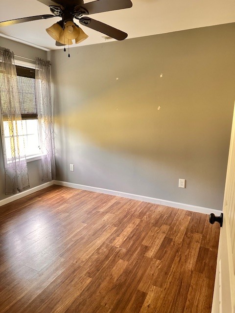 3242 Whitesell Road Culleoka, TN 38451 - Photo 6 of 17 wooden floor in an empty room with a window
