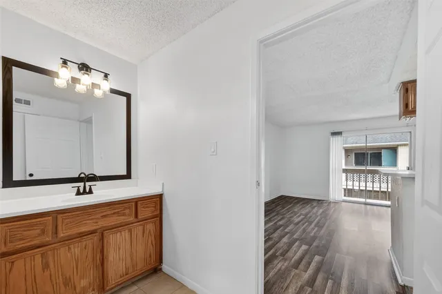 a swimming pool with outdoor seating and yard