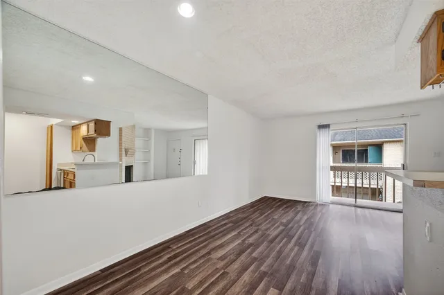 a view of livingroom with furniture and wooden floor
