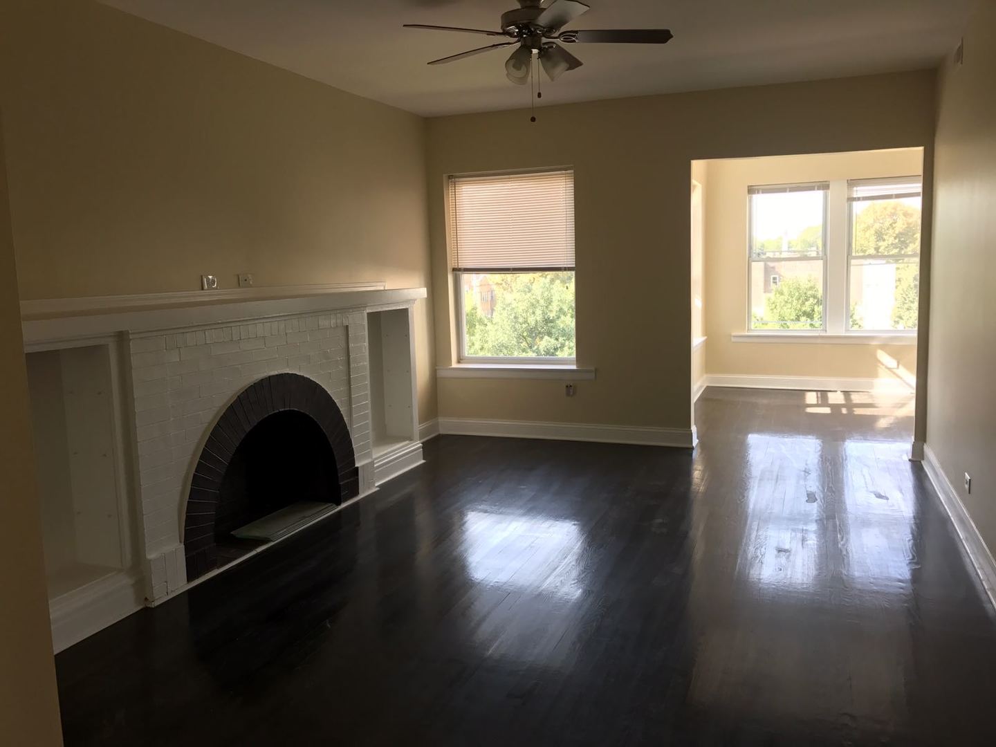 Undisclosed Address Chicago, IL 60625 - Photo 2 of 11 a view of empty room with wooden floor and fan