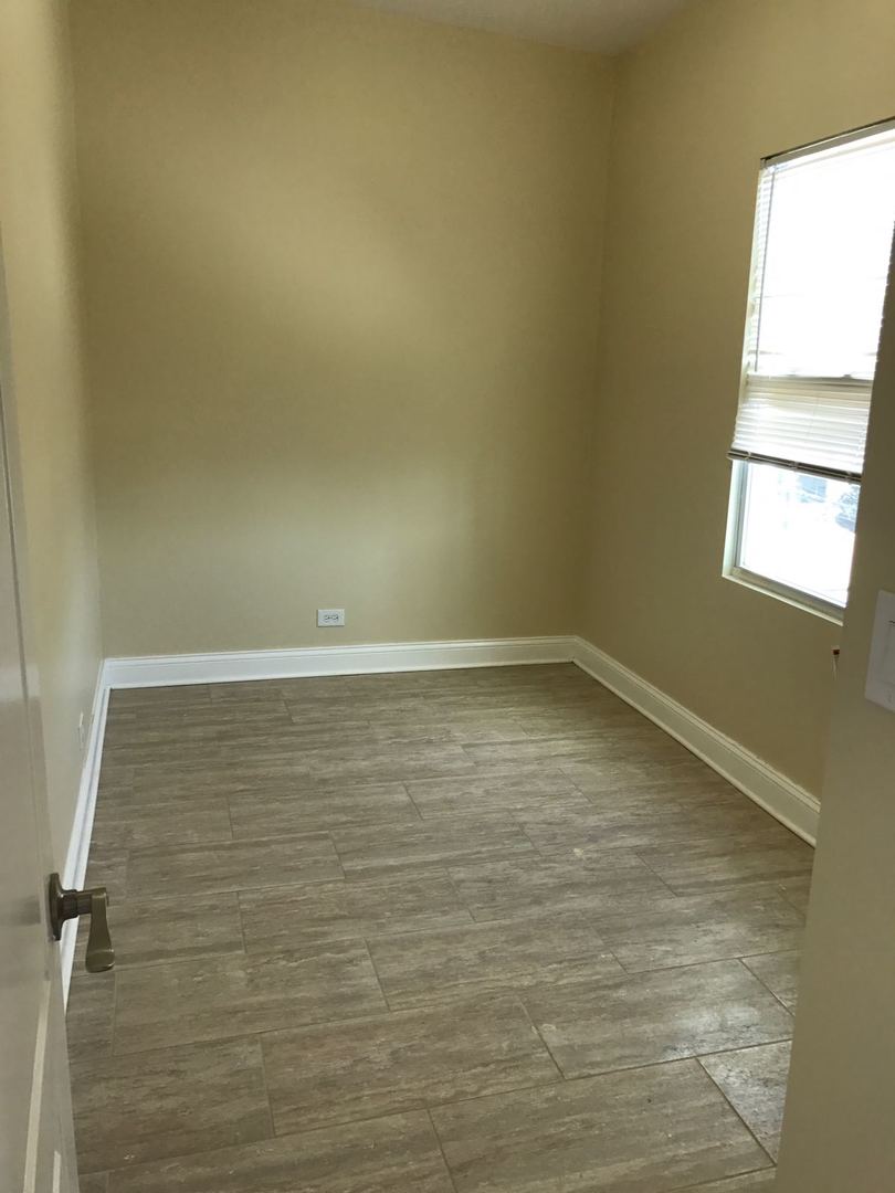 Undisclosed Address Chicago, IL 60625 - Photo 11 of 11 a view of room with window