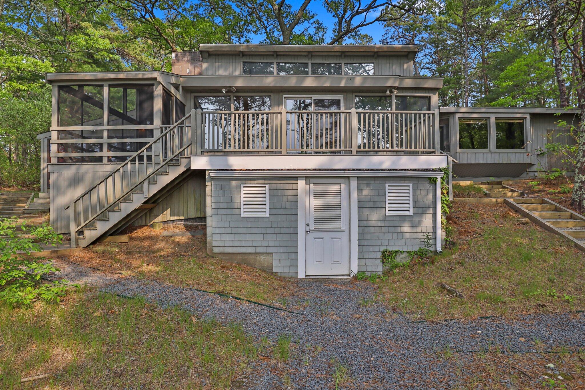 346 Setucket Road Dennis, MA 02638 - Photo 11 of 41 front view of house with a yard
