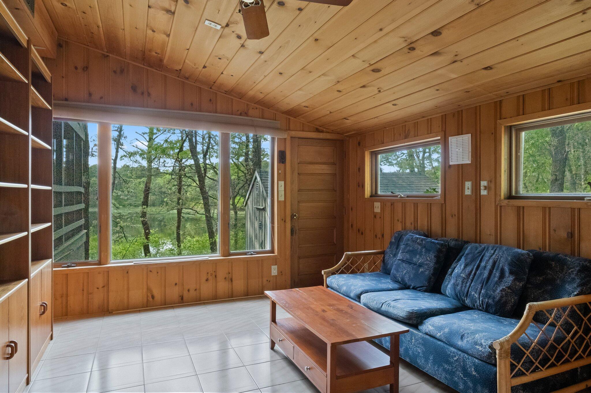 346 Setucket Road Dennis, MA 02638 - Photo 22 of 41 a living room with furniture and a large window