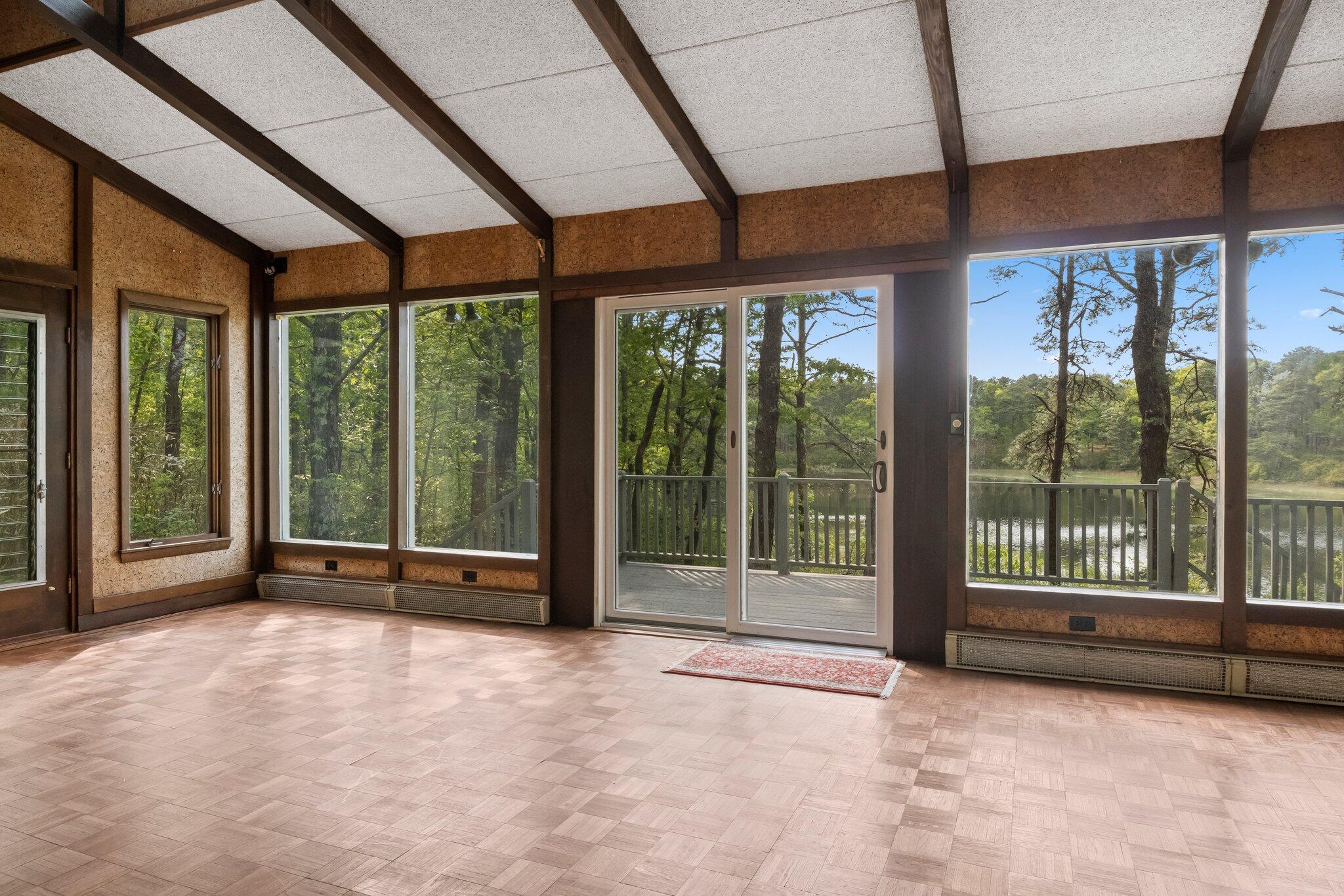 346 Setucket Road Dennis, MA 02638 - Photo 29 of 41 a view of an empty room with windows and balcony