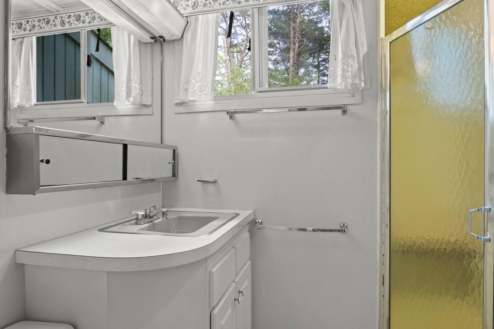 346 Setucket Road Dennis, MA 02638 - Photo 34 of 41 a bathroom with a sink and a mirror