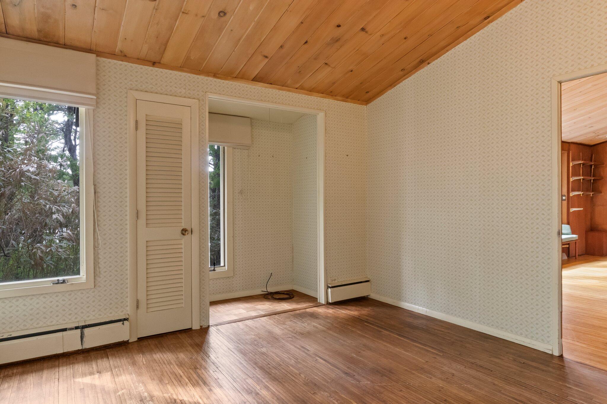 346 Setucket Road Dennis, MA 02638 - Photo 35 of 41 a view of an empty room with wooden floor and a window