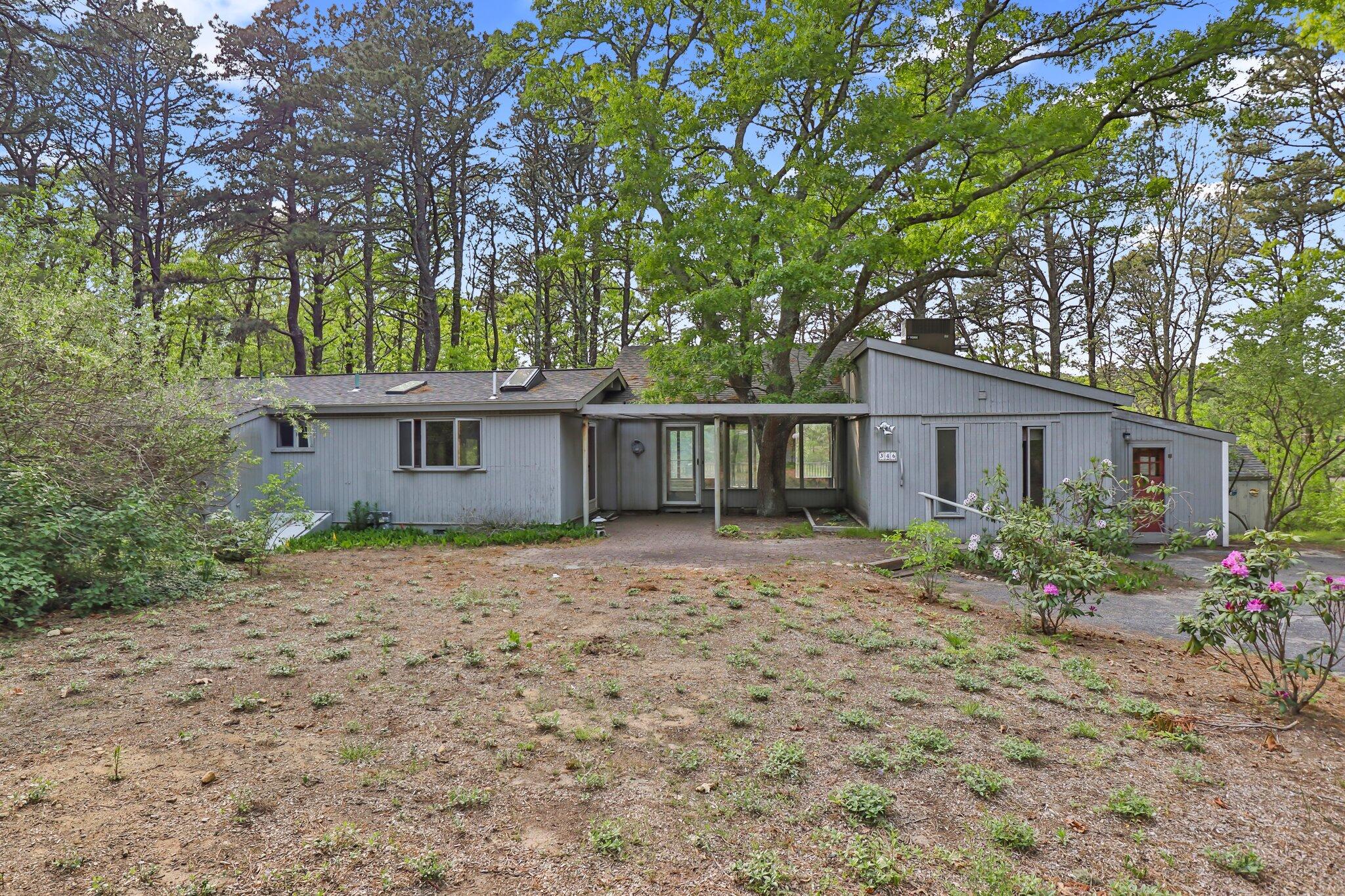 346 Setucket Road Dennis, MA 02638 - Photo 6 of 41 a front view of a house with garden