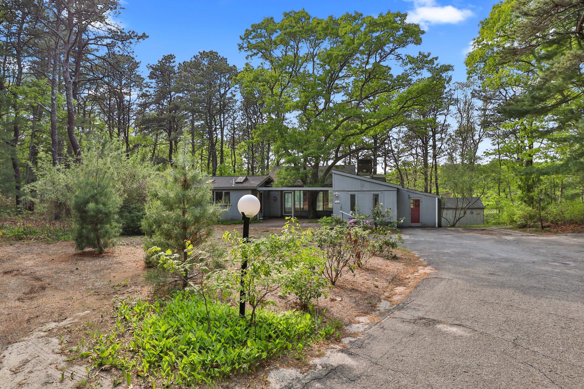 346 Setucket Road Dennis, MA 02638 - Photo 7 of 41 a backyard of a house with lots of green space