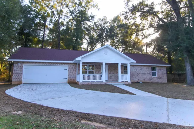 a front view of a house with yard