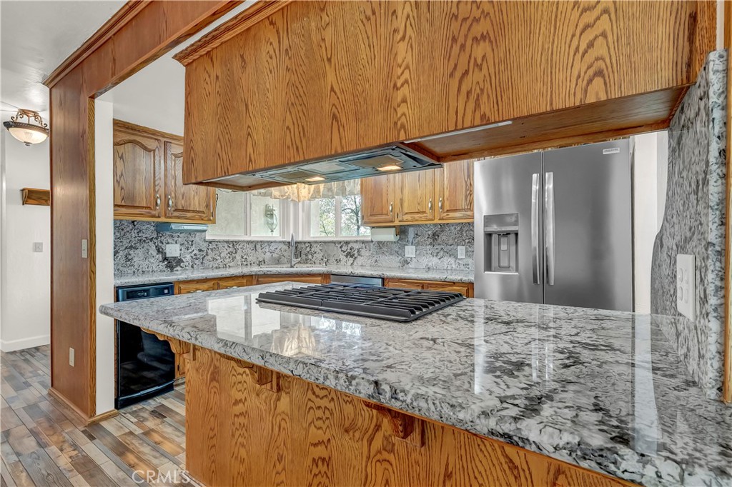 18002 Road 320 Springville, CA 93265 - Photo 28 of 56 a kitchen with stainless steel appliances granite countertop a sink and a counter space