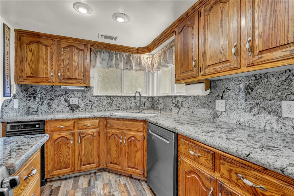 18002 Road 320 Springville, CA 93265 - Photo 30 of 56 a kitchen with stainless steel appliances granite countertop a sink and cabinets