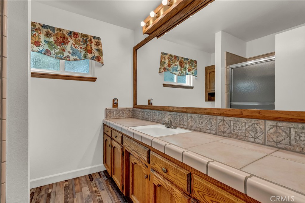 18002 Road 320 Springville, CA 93265 - Photo 37 of 56 a bathroom with a sink and a mirror