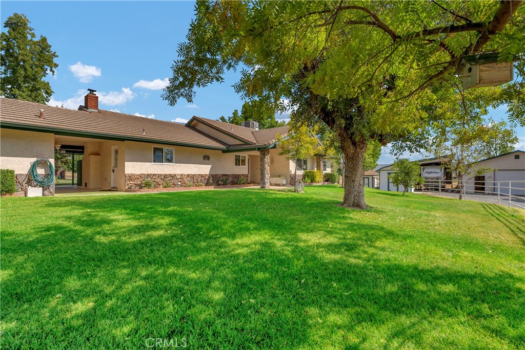 18002 Road 320 Springville, CA 93265 - Photo 4 of 57 a front view of a house with garden