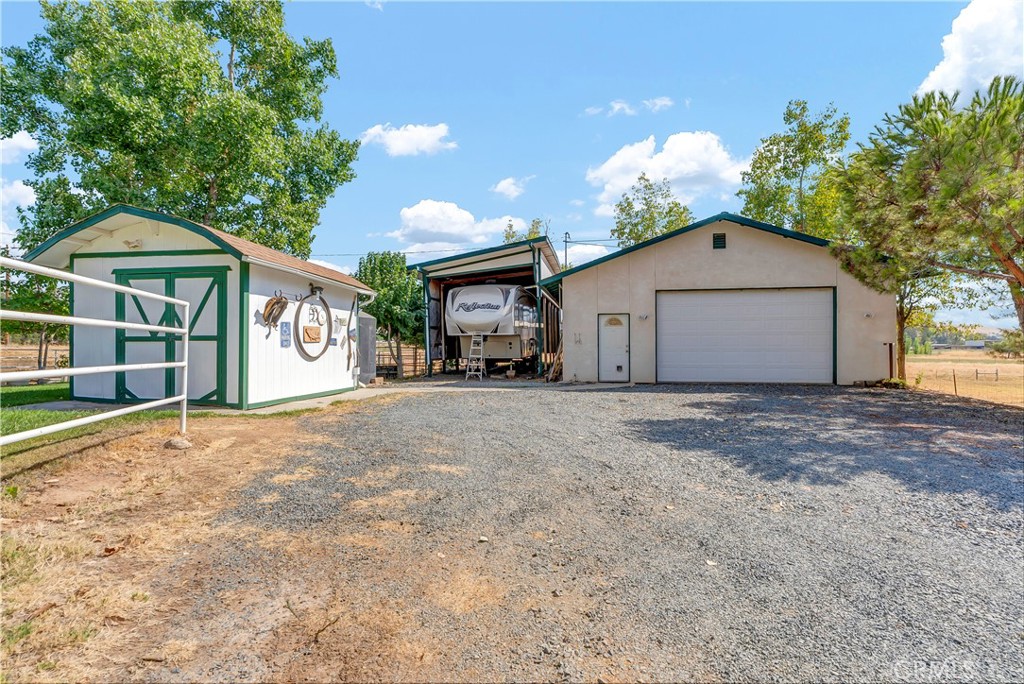 18002 Road 320 Springville, CA 93265 - Photo 5 of 56 a view of a house with a yard and garage