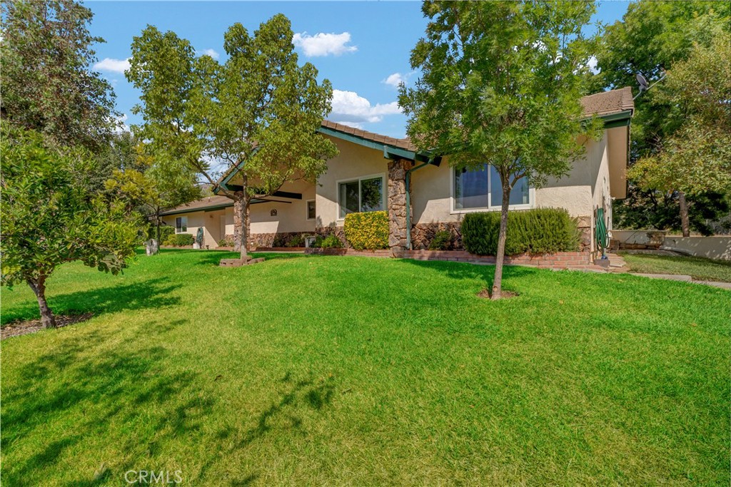 18002 Road 320 Springville, CA 93265 - Photo 5 of 57 a view of a house with a backyard and a tree