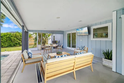a view of living room with furniture and floor to ceiling window