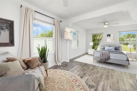 a bedroom with a large bed and a couch