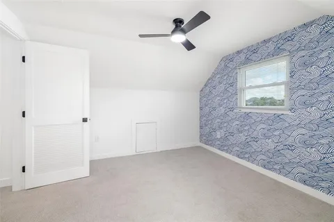 an empty room with a empty space and windows