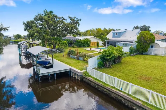 a view of a lake with a house in the background