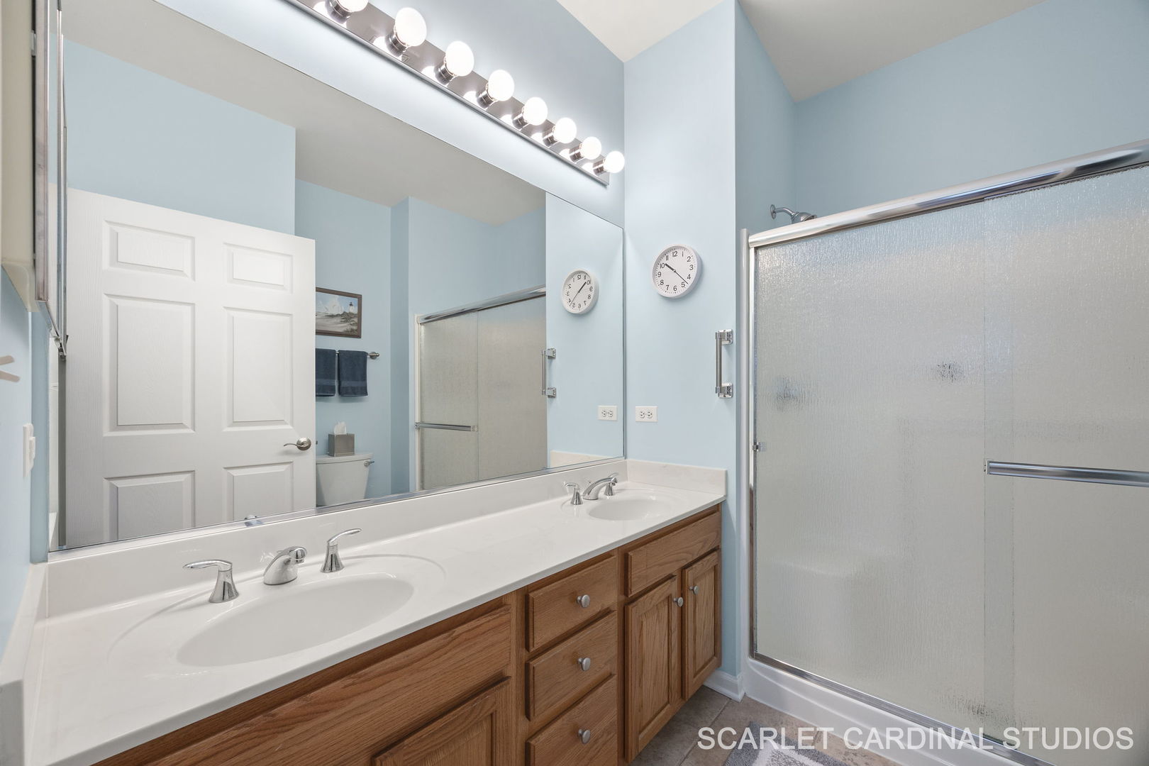 869 Cambridge Drive Batavia, IL 60510 - Photo 13 of 19 a bathroom with a double vanity sink and a mirror