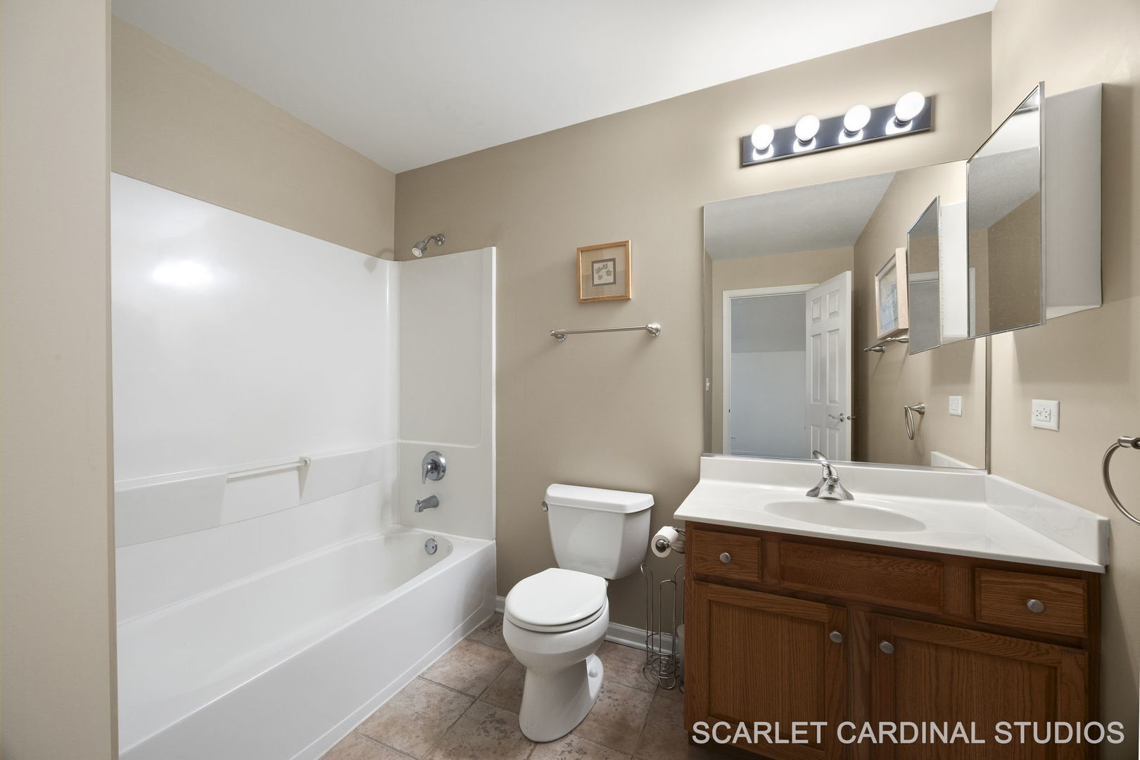 869 Cambridge Drive Batavia, IL 60510 - Photo 16 of 19 a bathroom with a sink a toilet and shower