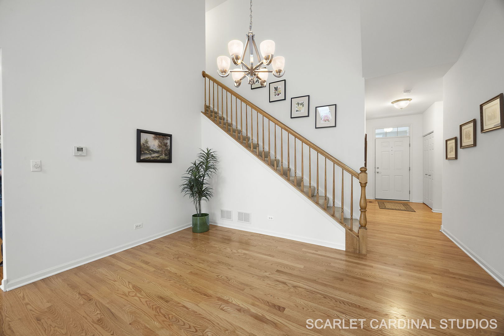 869 Cambridge Drive Batavia, IL 60510 - Photo 2 of 19 a view of entryway and hall with wooden floor