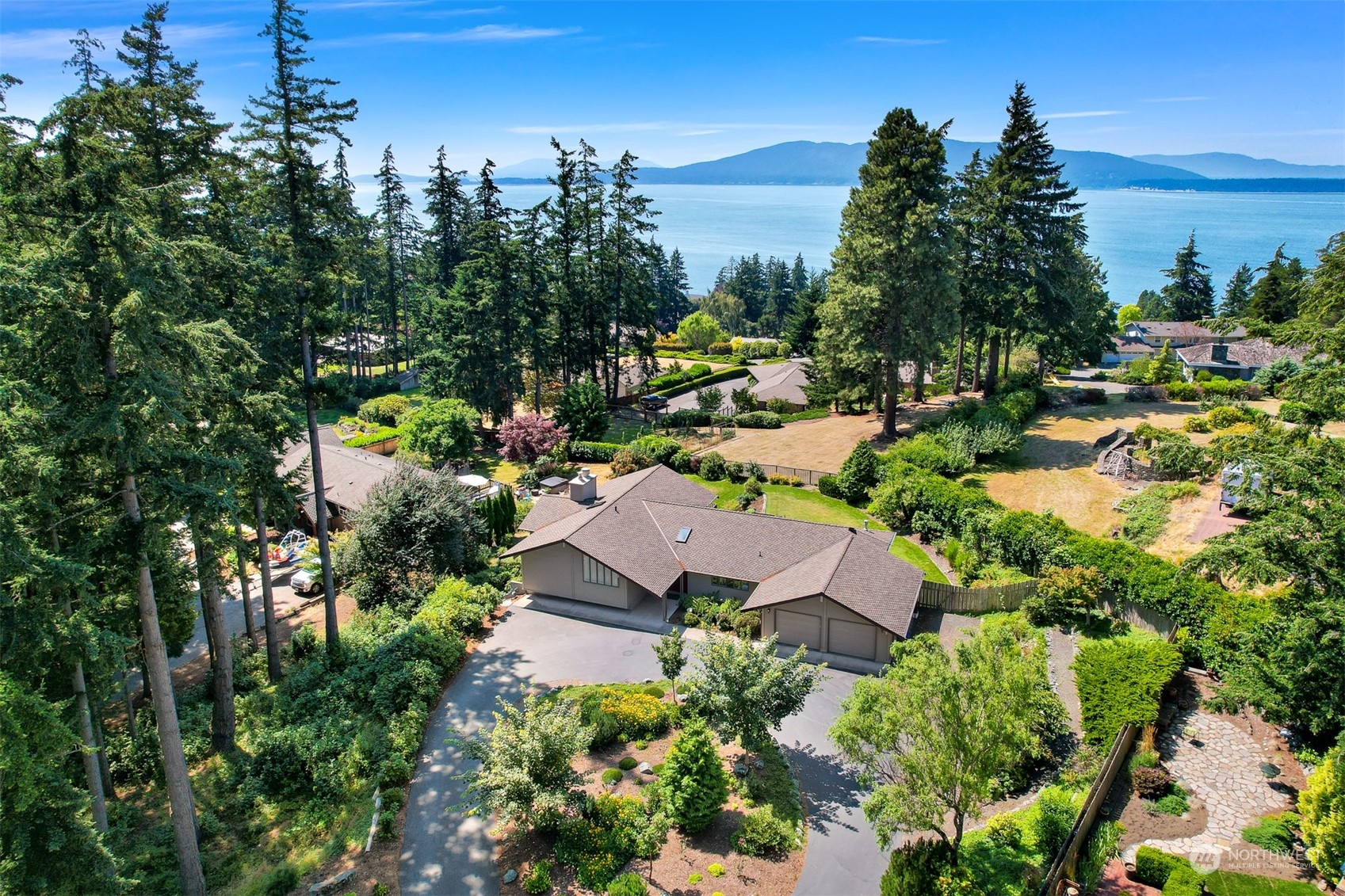 410 Fieldston Road Bellingham, WA 98225 - Photo 2 of 9 an aerial view of residential house with outdoor space and trees all around