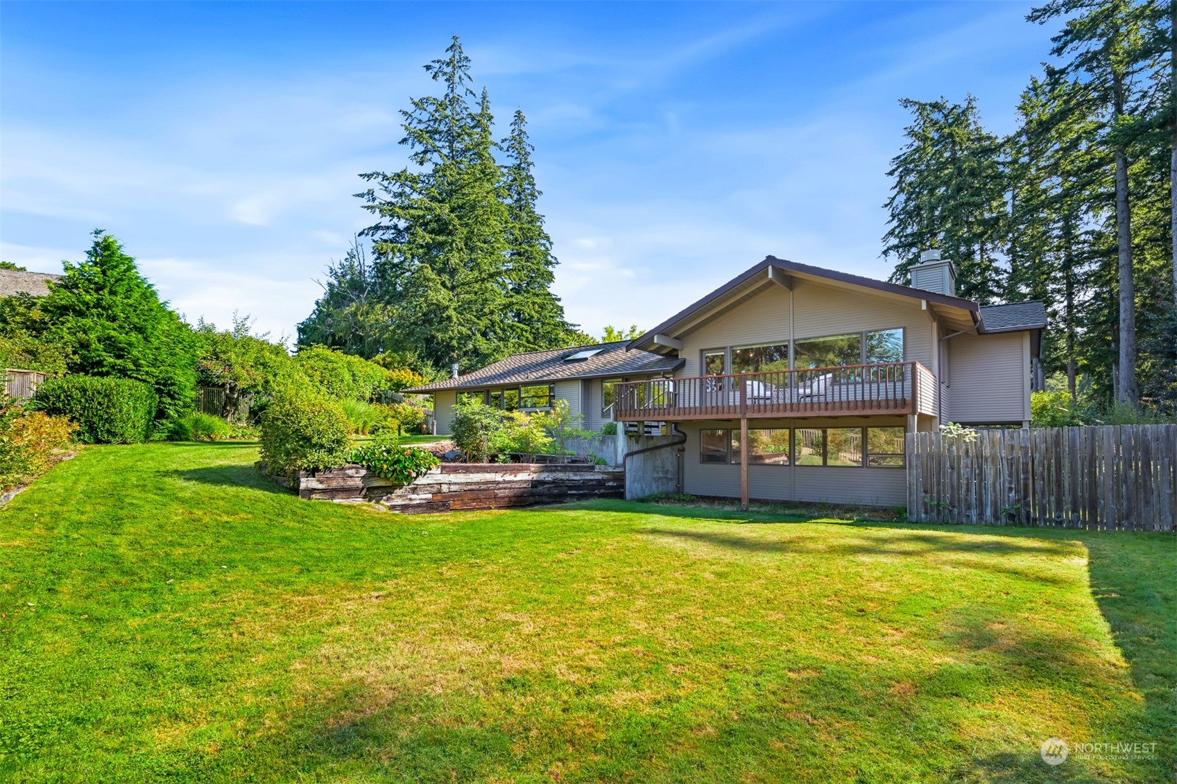 410 Fieldston Road Bellingham, WA 98225 - Photo 9 of 9 a view of a house with a yard table and chairs