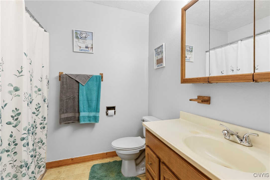 7530 East Lake Road Vienna, NY 13308 - Photo 11 of 35 Main floor full bathroom