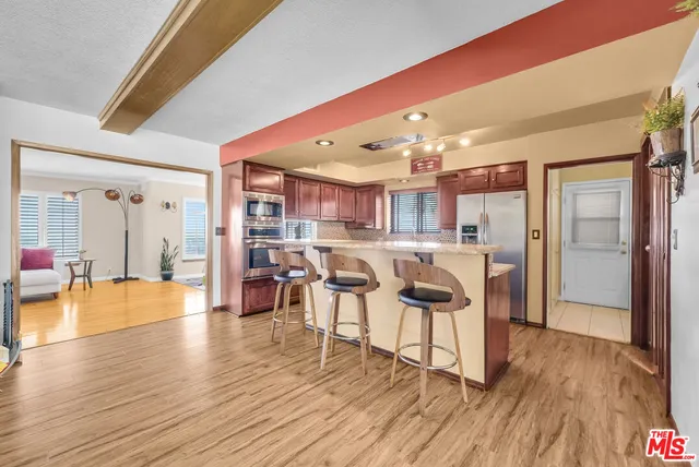 a view of a kitchen and dining room