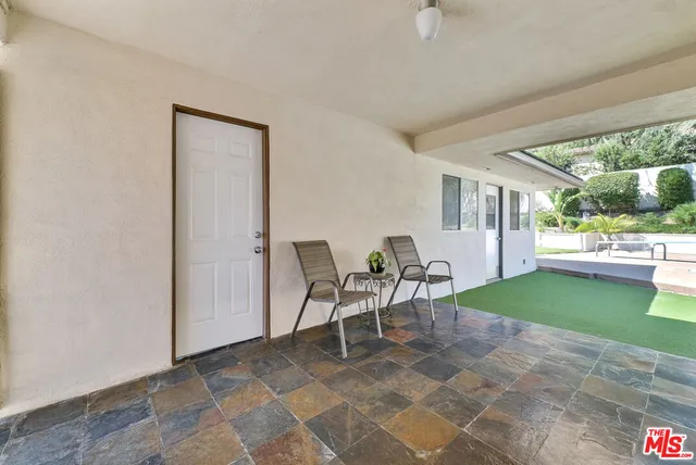 a workspace with furniture and a window