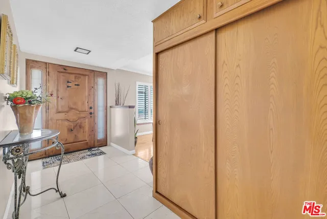 a view of an empty room and a window