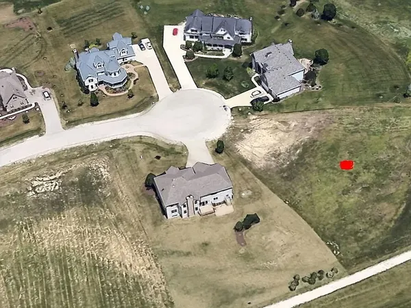 an aerial view of a house with outdoor space