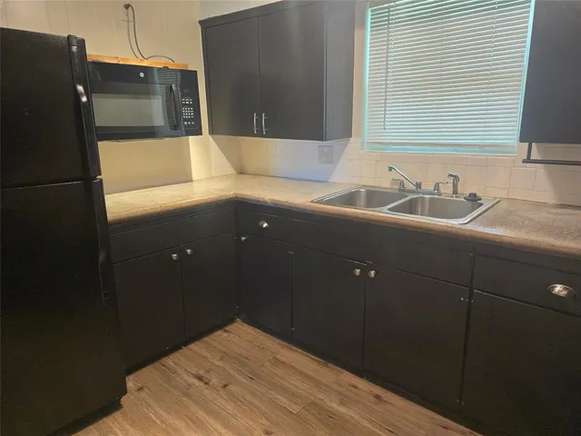 a bathroom with a bathtub and a sink