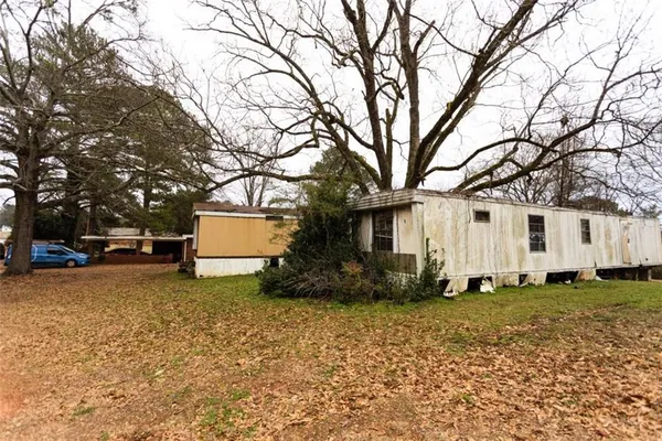a view of outdoor space with deck and trees