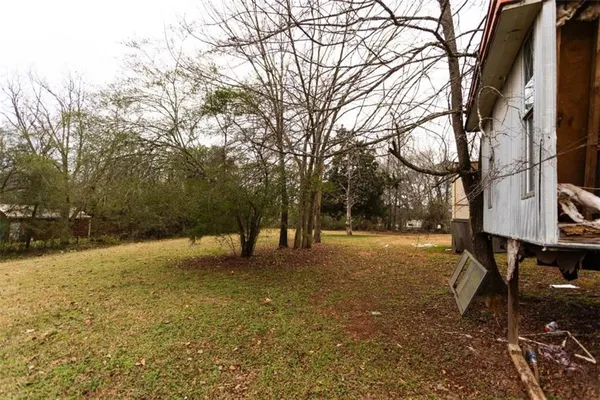 a view of swimming pool with a yard