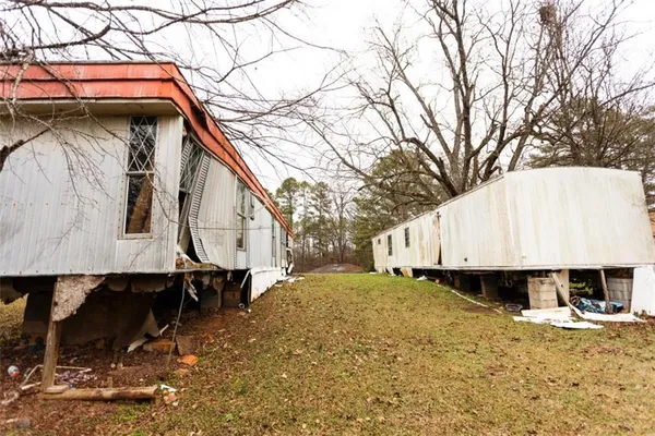 a large tree in front of a house