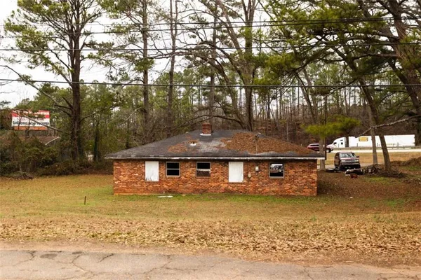 a view of park with large trees