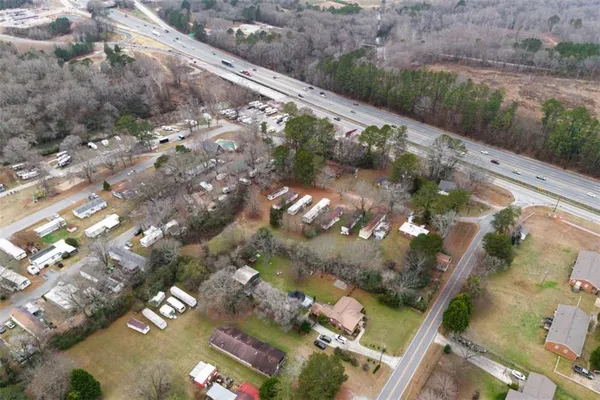 an aerial view of residential houses with outdoor space