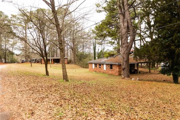 a view of a building with a yard