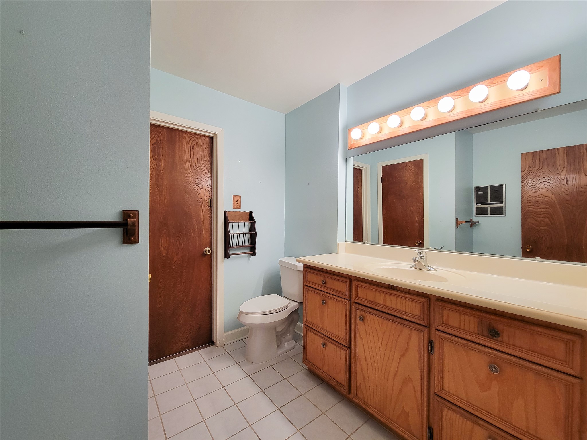 12119 Beverly Drive Houston, TX 77065 - Photo 20 of 32 a bathroom with a sink and a mirror