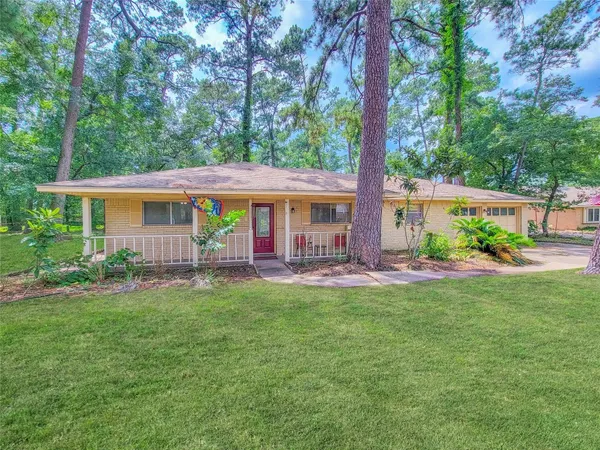 a view of a house with a yard patio and garden