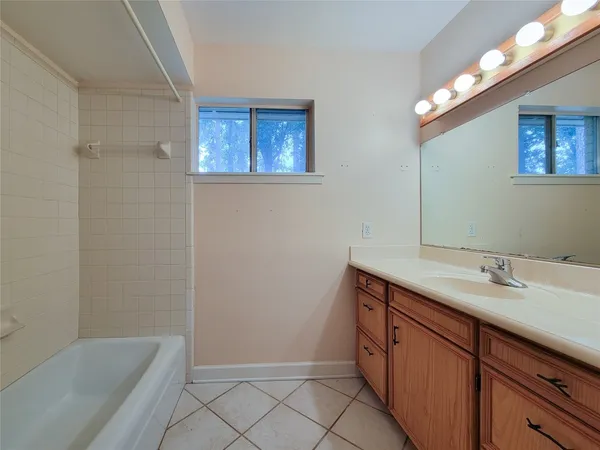 an empty room with windows and window