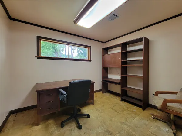 a view of a workspace with furniture