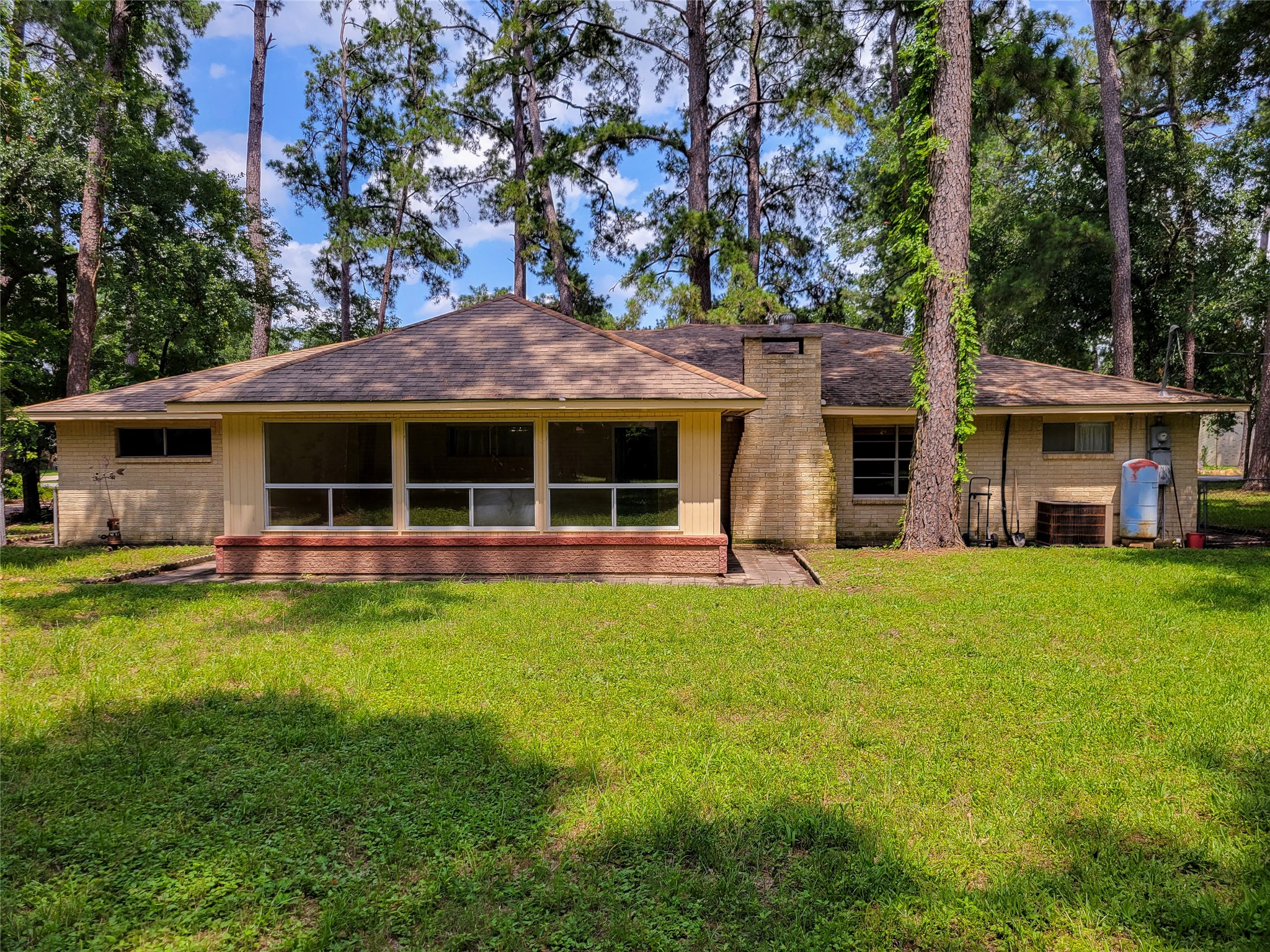 12119 Beverly Drive Houston, TX 77065 - Photo 26 of 32 a view of a house with a yard and sitting area