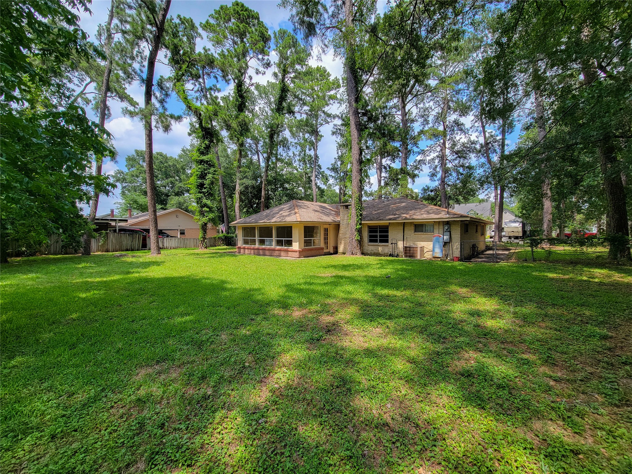 12119 Beverly Drive Houston, TX 77065 - Photo 28 of 32 a view of a house with a big yard and large trees