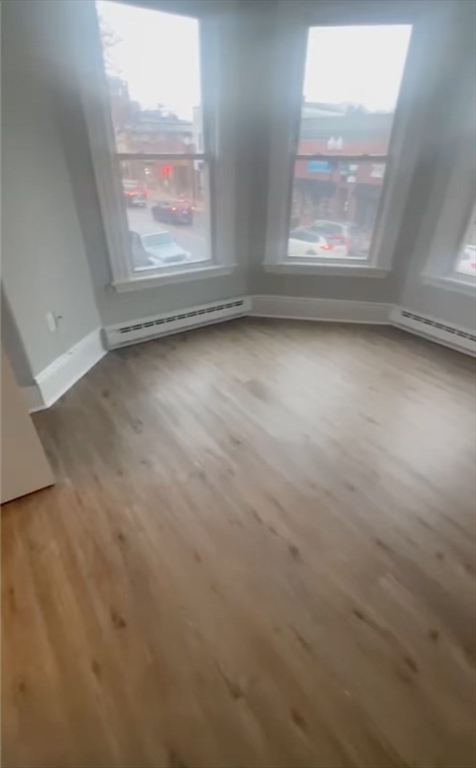 452 Main Street, Unit 4 Melrose, MA 02176 - Photo 6 of 8 an empty room with windows